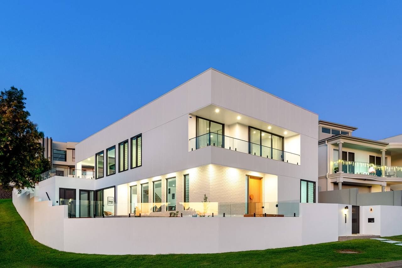 White contemporary home at dusk