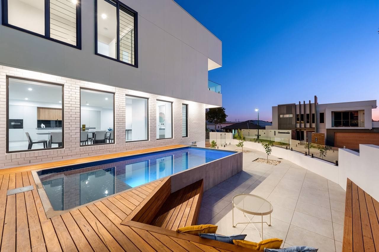 Pool and timber deck at dusk