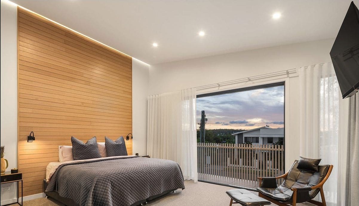 Main bedroom with a timber feature wall