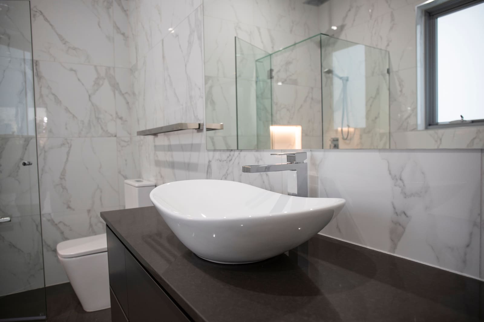 Bathroom with a stone vessel basin