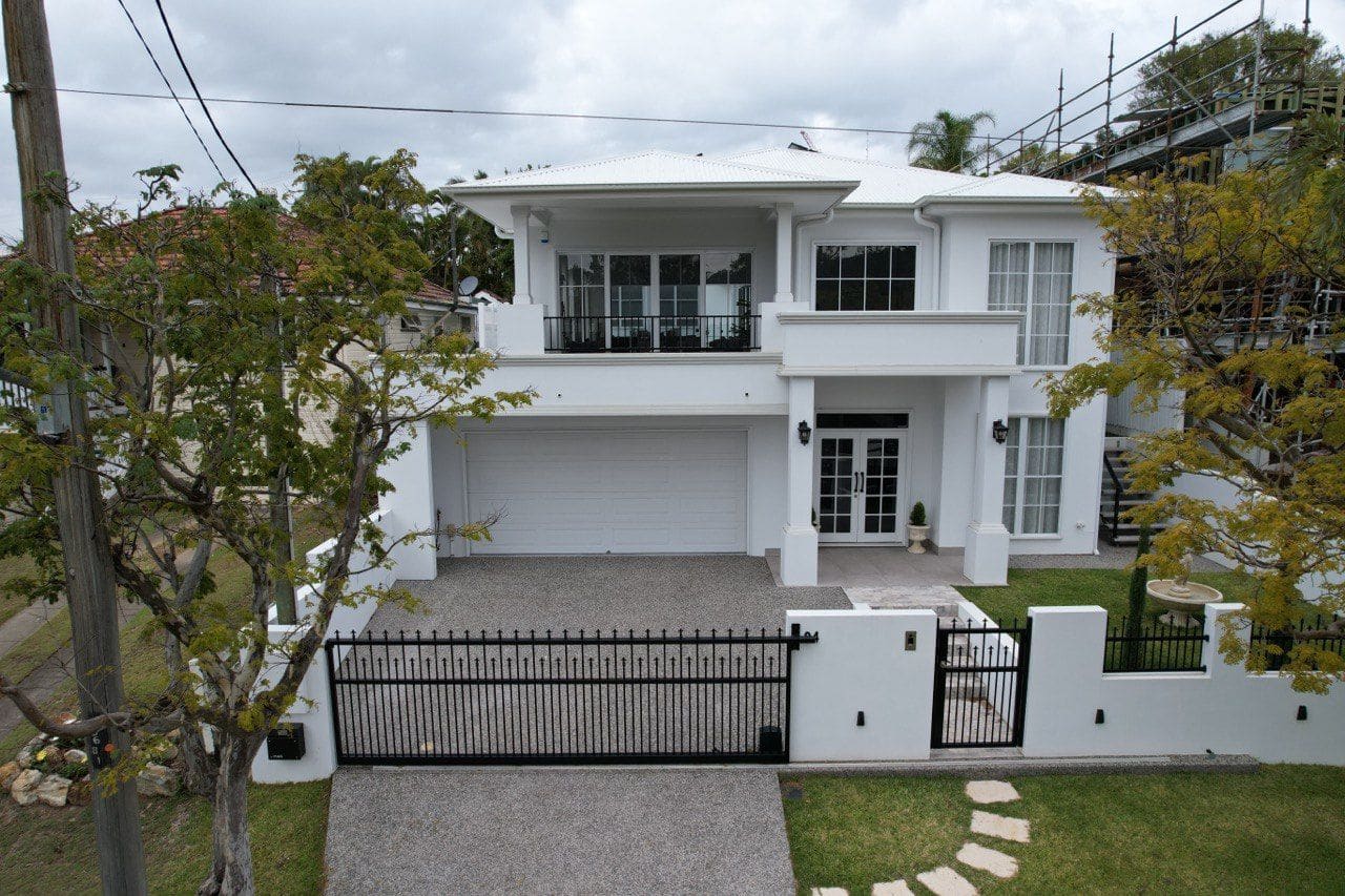 White two-storey facade with balconies
