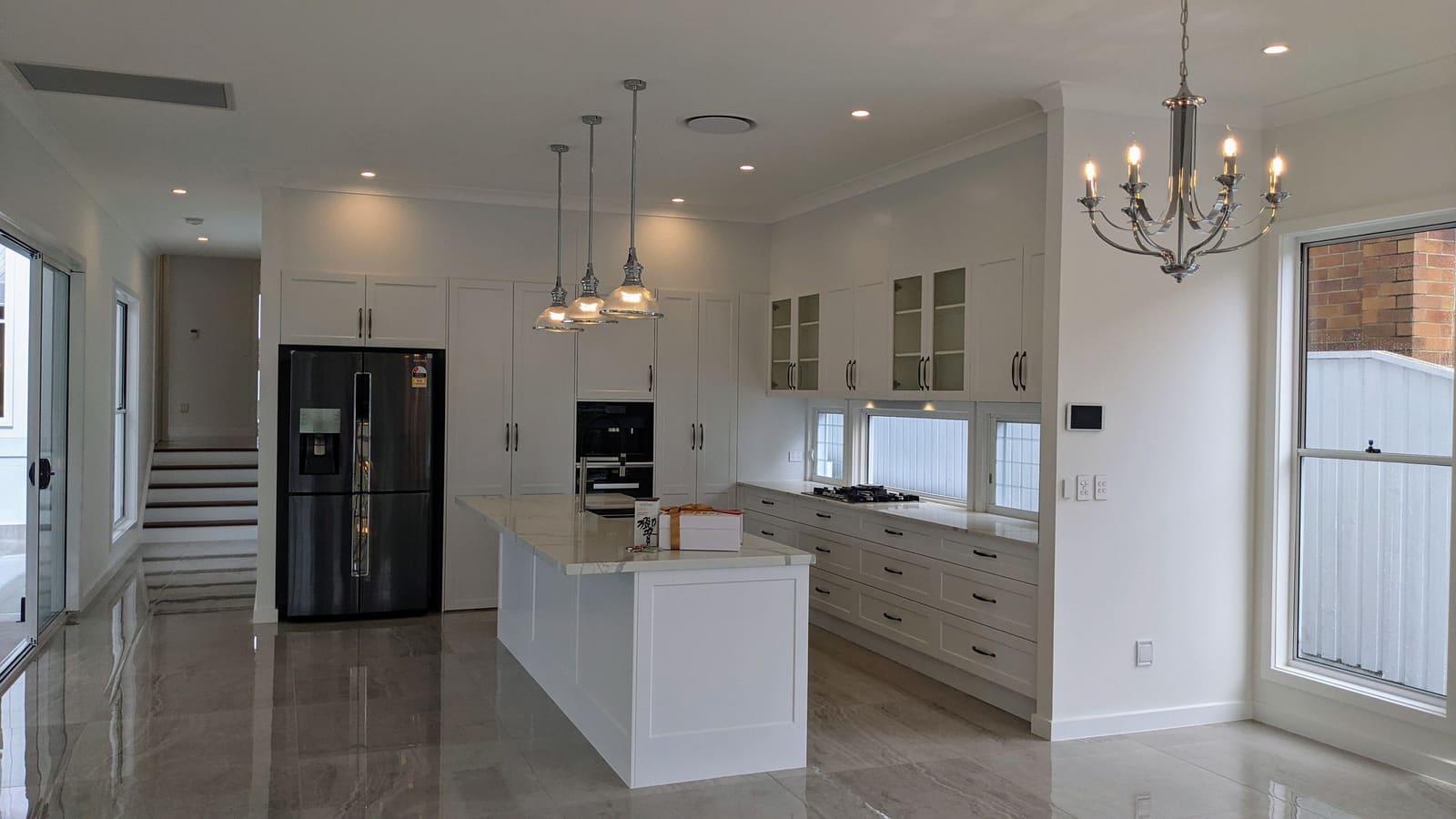 Kitchen with island bench and pendant lights