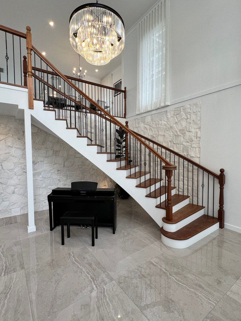 Staircase beneath a chandelier