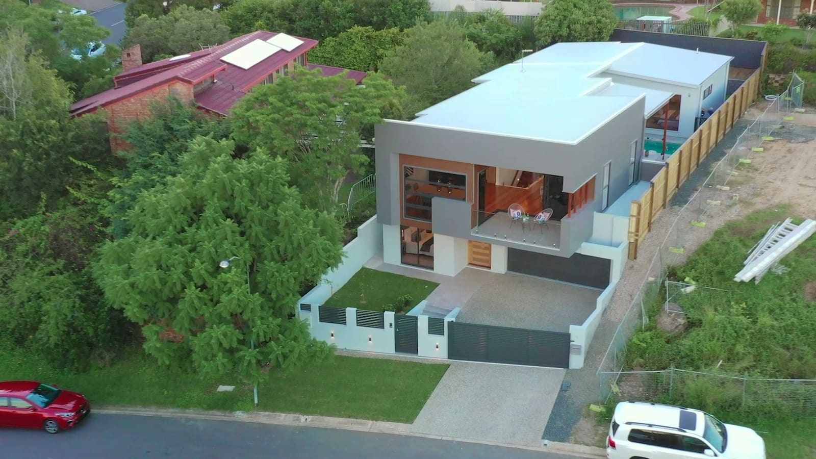 Aerial view of the home on its street