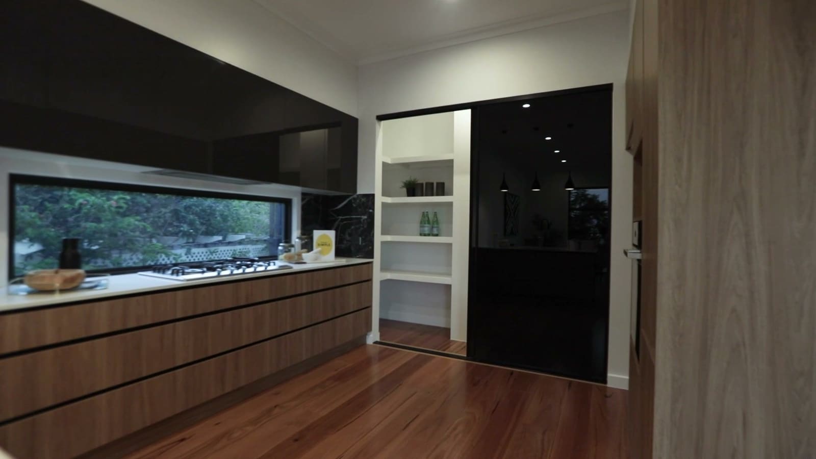 Kitchen with a window splashback