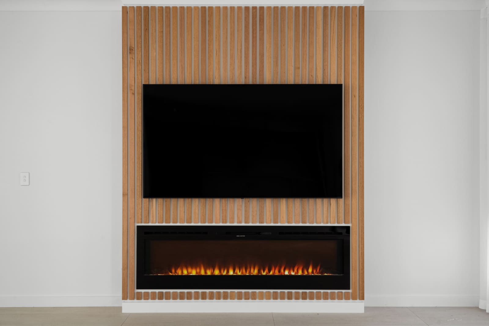 Fireplace set in a timber batten feature wall
