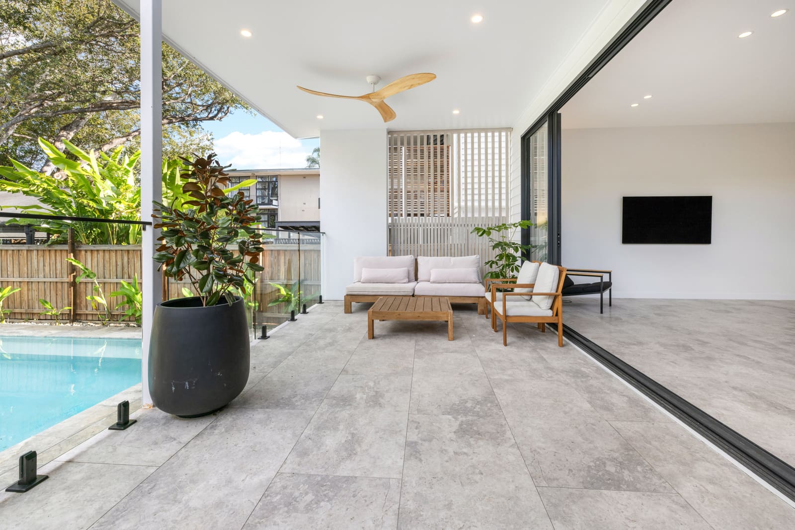 Outdoor living room beside the pool