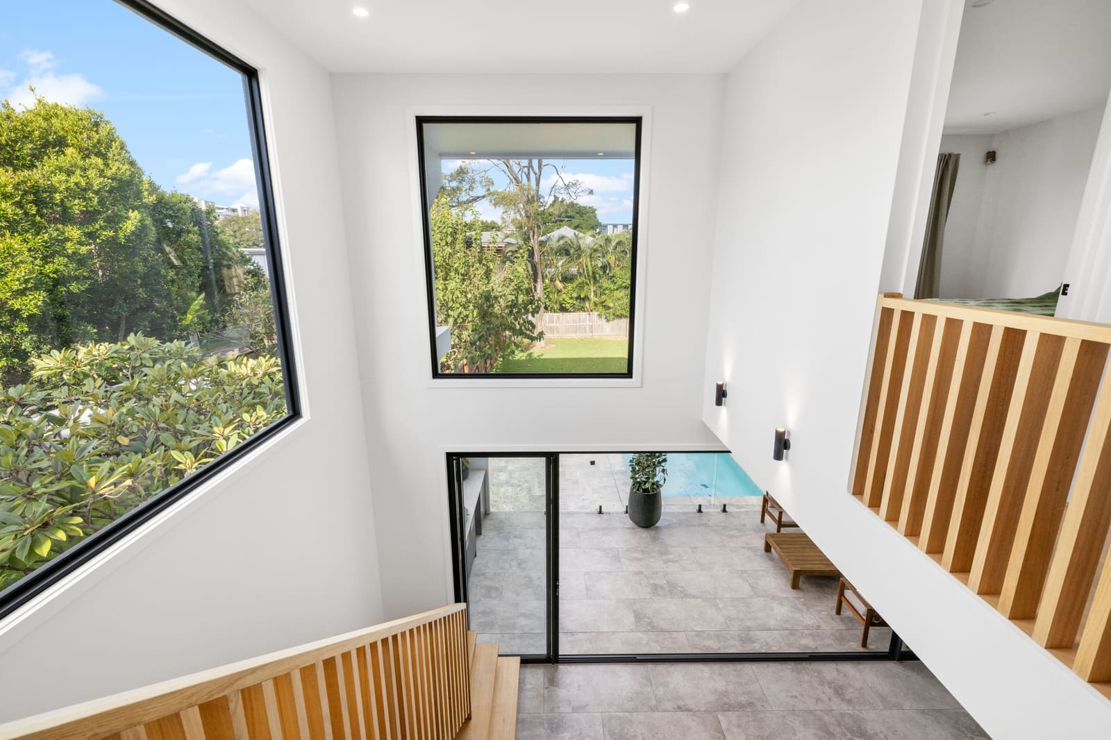 Stair void with a framed garden window