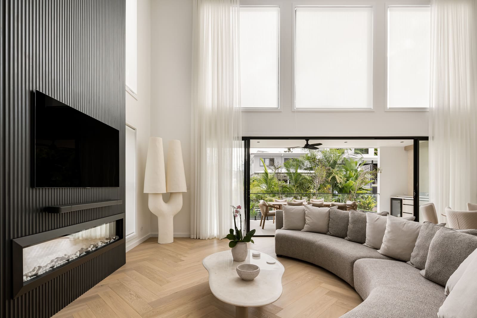 Living room opening to the alfresco terrace