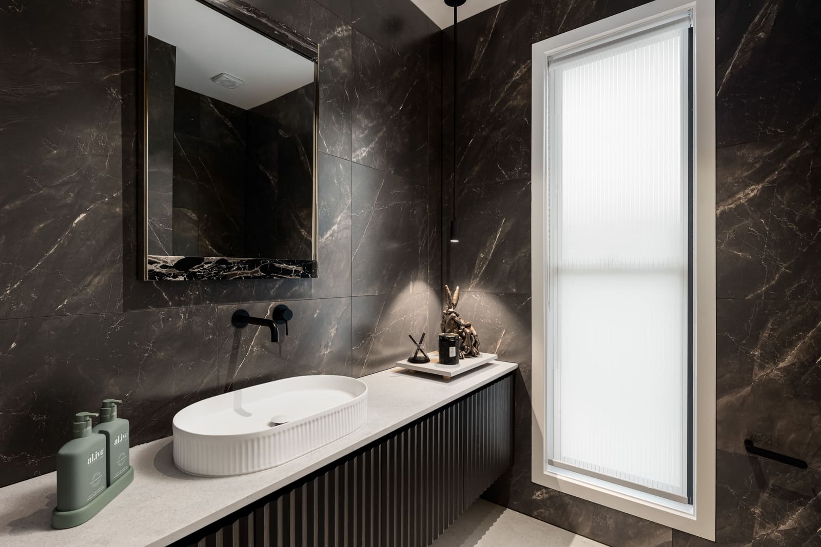 Powder room in dark marble