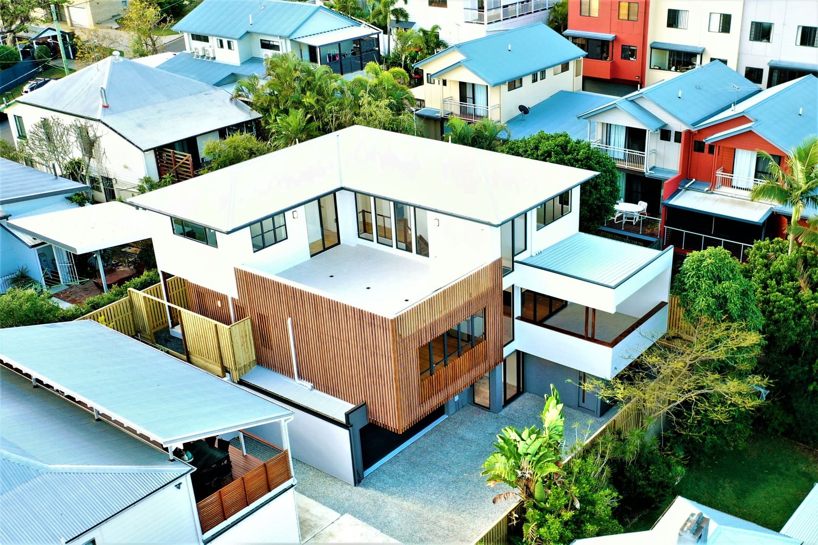 Aerial view of the home among neighbouring rooftops