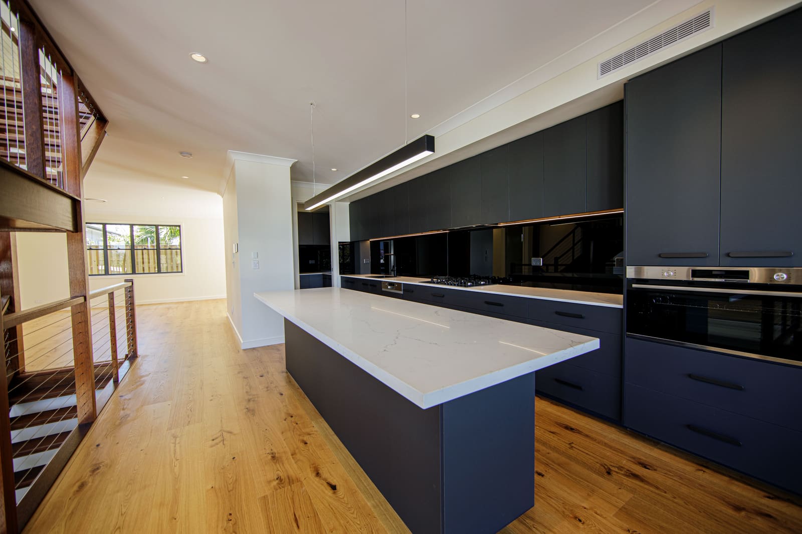 Kitchen island and the stair void