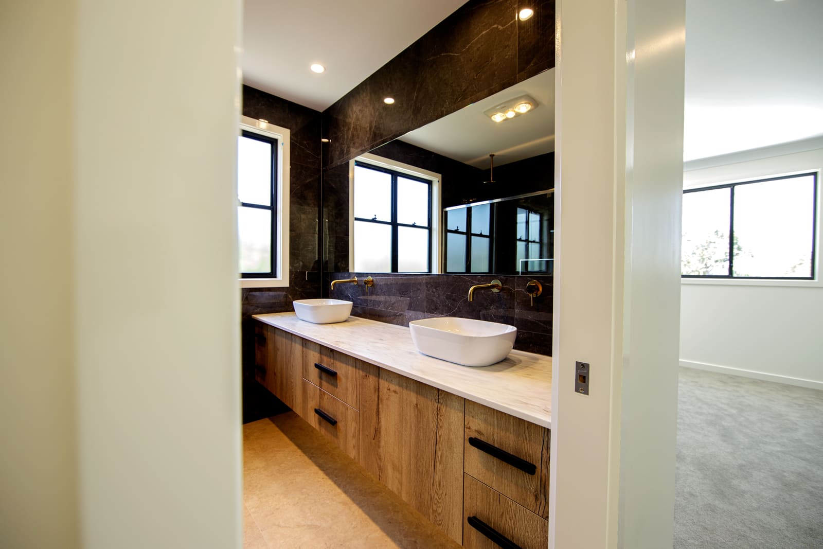 Bathroom vanity in timber and stone